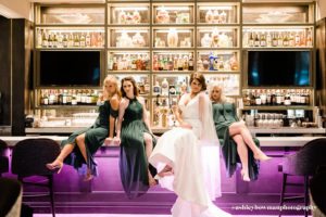 Bridal party posing at the Fifth Avenue Syndicate bar