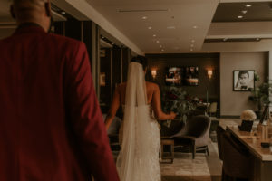 Bride walking to the aisle at the Axis Hotel