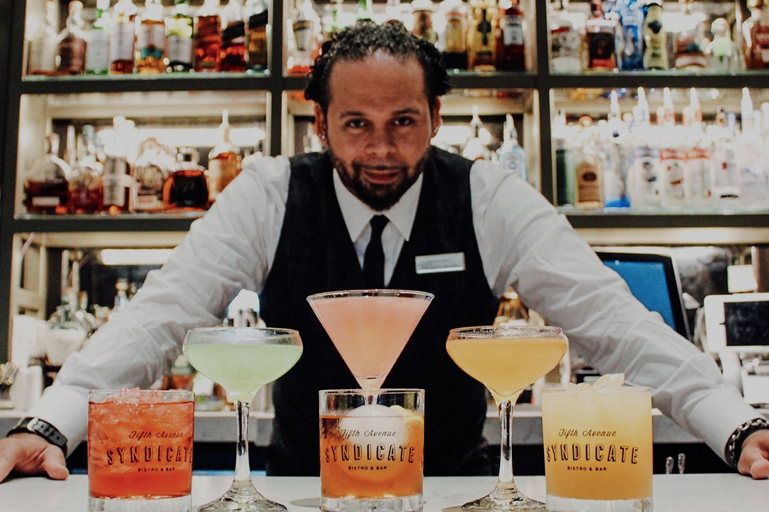 craft cocktails in front of bartender
